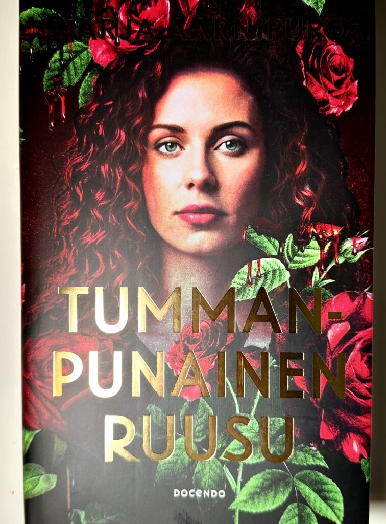 tummanpunainen-ruusu-kirja